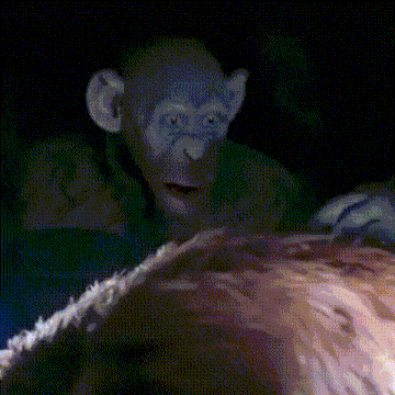 A Pixelated Image Of A Monkey Looking At A Woman 'S Face GIF