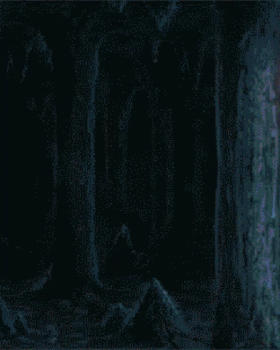 A Pixelated Image Of A Person With A Red Eye And The Letter N On The Bottom Right GIF