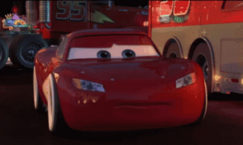 A Pixelated Image Of A Red Car With A License Plate That Says ' Rc ' On It GIF