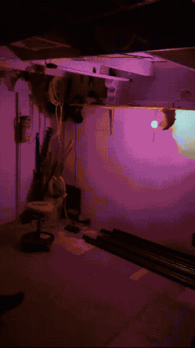 a pixelated image of a room with purple lighting