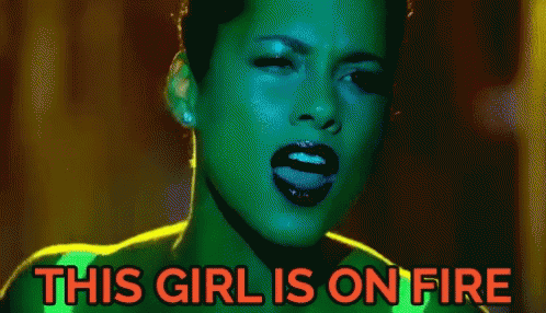 A Pixelated Image Of A Woman With The Words " This Girl Is On Fire " Above Her GIF