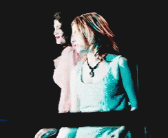 A Pixelated Image Of Two Women Dancing With One Wearing A Pink Top GIF