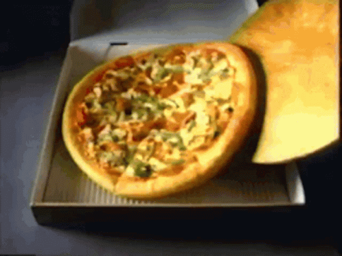A Pizza In A Cardboard Box With A Slice Missing GIF
