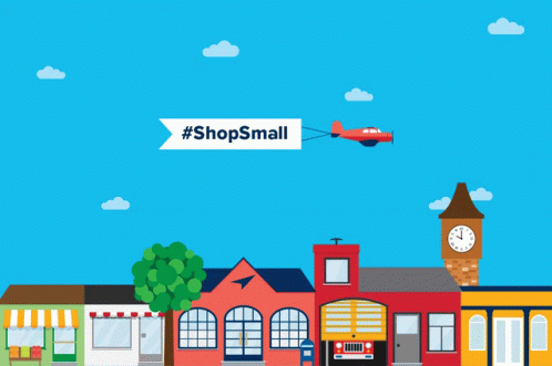 A Plane Is Flying Over A Small Town With A Banner That Says #Shopssmall GIF