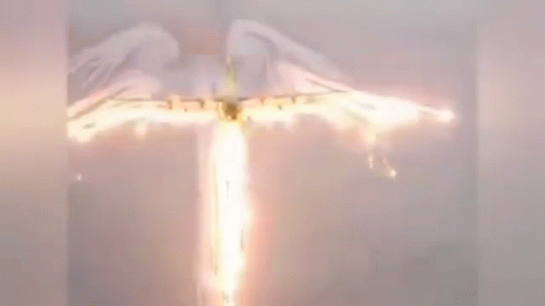 A Plane Is Flying Through The Air With A Flame Coming Out Of It . GIF