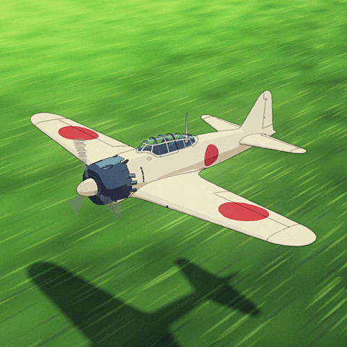 A Plane With A Red Circle On The Wing Is Flying Over A Green Field GIF
