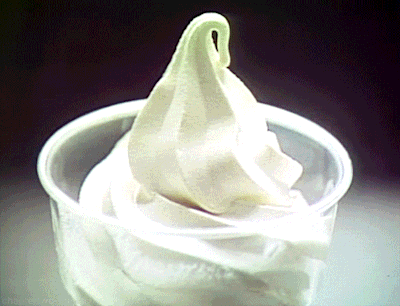 A Plastic Cup Filled With A Swirl Of Ice Cream GIF