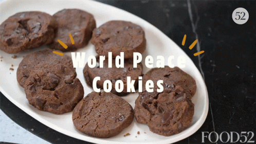 A Plate Of Chocolate Cookies With The Words " World Peace Cookies " Above Them GIF