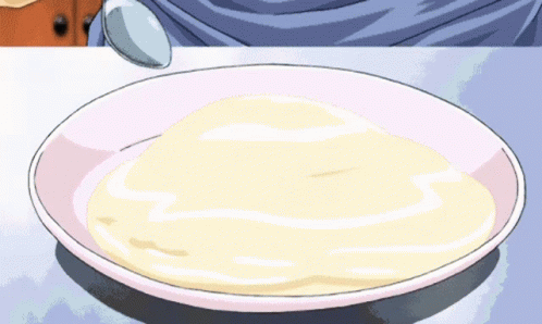 A Plate Of Food With A Spoon On It GIF