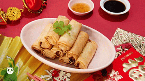 A Plate Of Food With Chopsticks And A Red Envelope That Says ' Fortune ' On It GIF