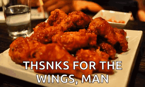 A Plate Of Fried Chicken Wings With The Words Thanks For The Wings Man GIF