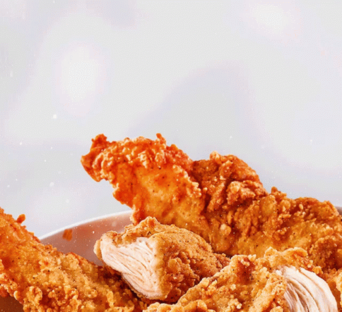 A Plate Of Fried Chicken With The Words Dip Eat Written In Red GIF