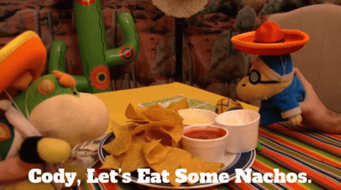 A Plate Of Nachos With The Words Cody Let 'S Eat Some Nachos Written On It GIF