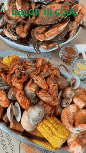 A Plate Of Seafood With The Words Bacon In Chat Written On It GIF