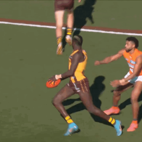 A Player With The Number 11 On His Jersey Is Running With The Ball GIF