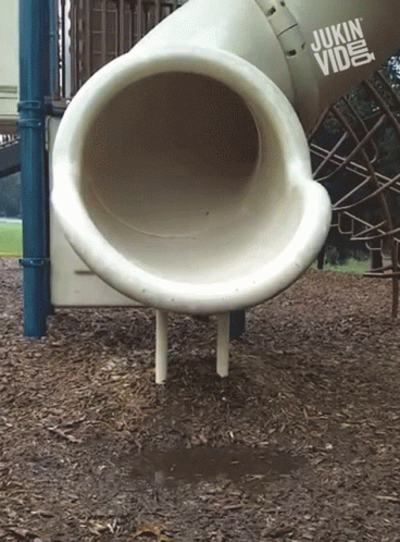A Playground With A Slide And A Sign That Says Jukin Video GIF