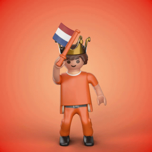 a playmobil figure has a crown on his head and holds a flag