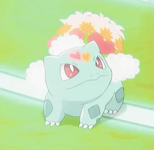 A Pokemon With A Flower On Its Head Is Sitting On A Grassy Field With Its Mouth Open . GIF
