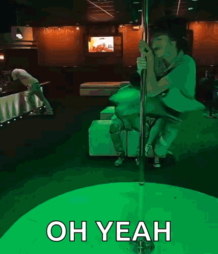 A Pole Dancer In A Club With The Words Oh Yeah GIF