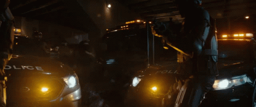 A Police Car Is Parked Next To A Ambulance GIF