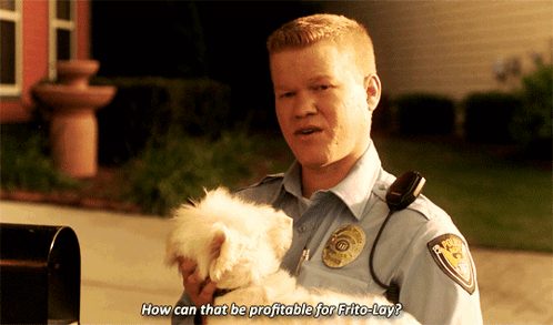 A Police Officer Is Holding A Small White Dog And Says How Can That Be Profitable For Frito-Lay GIF