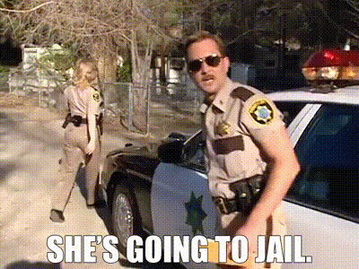 A Police Officer Is Standing In Front Of A Police Car With A Caption That Says She 'S Going To Jail GIF