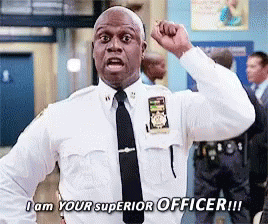 A Police Officer With His Fist In The Air Says I Am Your Superior Officer GIF