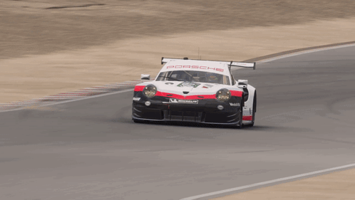 A Porsche Race Car Is On A Track GIF