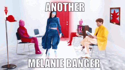 A Poster For Another Melanie Banger Shows A Woman In A Blue Outfit Standing In Front Of A Red Door GIF