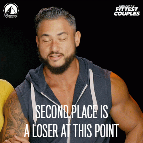 A Poster For Battle Of The Fittest Couples Shows A Man With His Eyes Closed And Says Second Place Is A Loser At This Poi GIF
