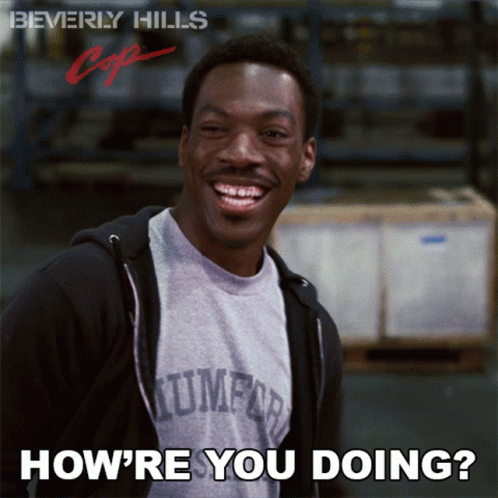 A Poster For Beverly Hills Cop Shows A Smiling Man GIF