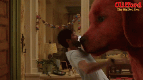 A Poster For Clifford The Big Red Dog Showing A Man And A Girl GIF