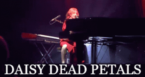 A Poster For Daisy Dead Petals Shows A Woman Playing A Keyboard GIF