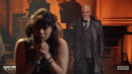 A Poster For Hadestown The Musical Shows A Man And Woman Singing GIF