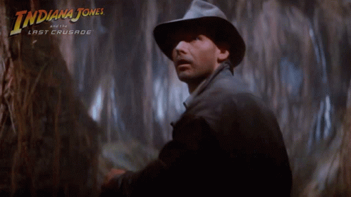 A Poster For Indiana Jones And The Last Crusade Features A Man In A Hat GIF