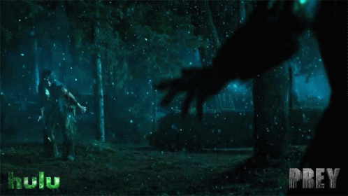 A Poster For Prey Shows A Man Being Attacked By A Monster In The Woods GIF