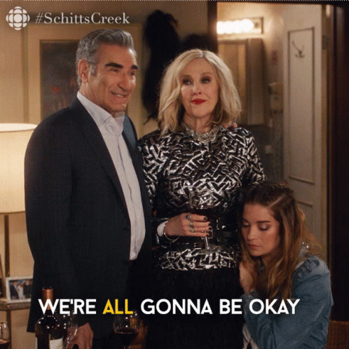 A Poster For Schitts Creek Shows A Man And Woman Standing Next To Each Other GIF