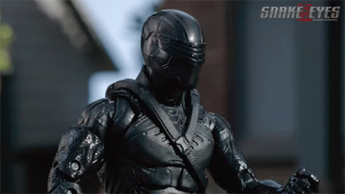 A Poster For Snake Eyes Shows A Soldier In A Black Suit GIF