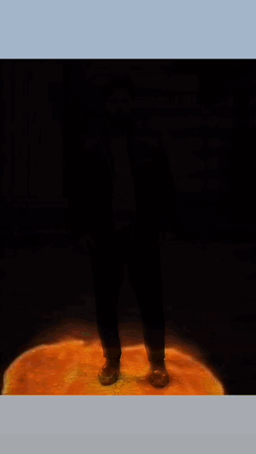 A Poster For Sweet Leaf Shows A Man Standing In Front Of A Fire GIF