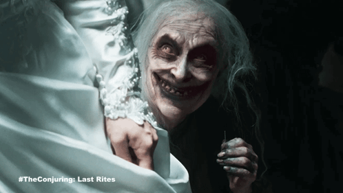 A Poster For The Conjuring Last Rites Shows A Ghostly Woman GIF