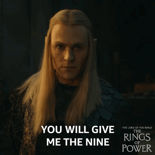 A Poster For The Lord Of The Rings Of Power Shows A Man With Long Blonde Hair GIF