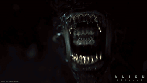 A Poster For The Movie Alien Romulus Shows A Close Up Of The Mouth GIF