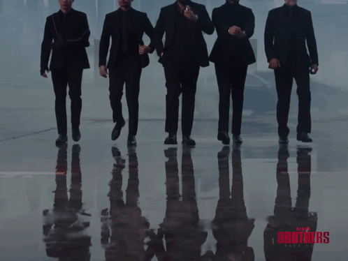A Poster For The Movie Blood Brothers Shows A Group Of Men Standing Next To Each Other GIF