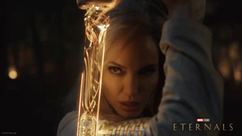 A Poster For The Movie Eternals Shows A Woman GIF