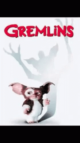 Gizmo Holding Paper Gremlins Poster GIF
