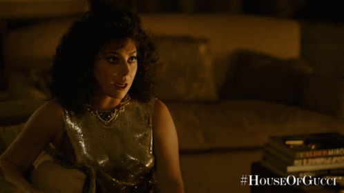 A Poster For The Movie House Of Gucci Shows A Woman GIF