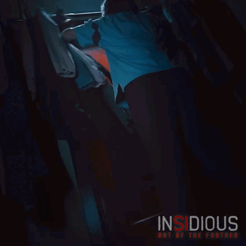 a poster for the movie insidious out of the further shows a man reaching for a door