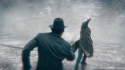 A Poster For The Movie Secrets Of Dumbledore Shows A Man And Woman GIF