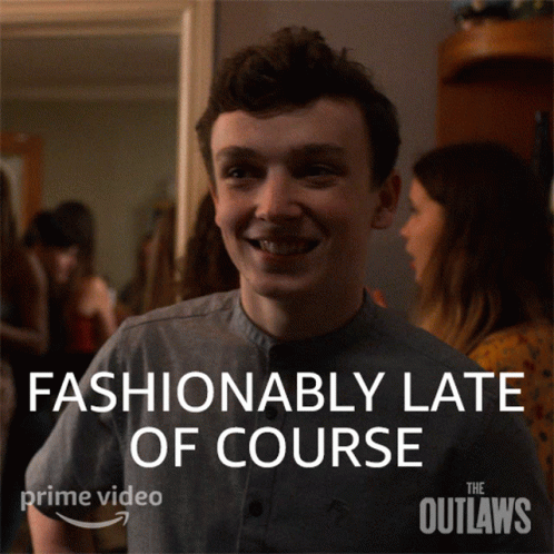 A Poster For The Outlaws Shows A Man Smiling And Says Fashionably Late Of Course GIF