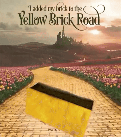 A Poster For The Yellow Brick Road With A Yellow Brick In The Middle GIF